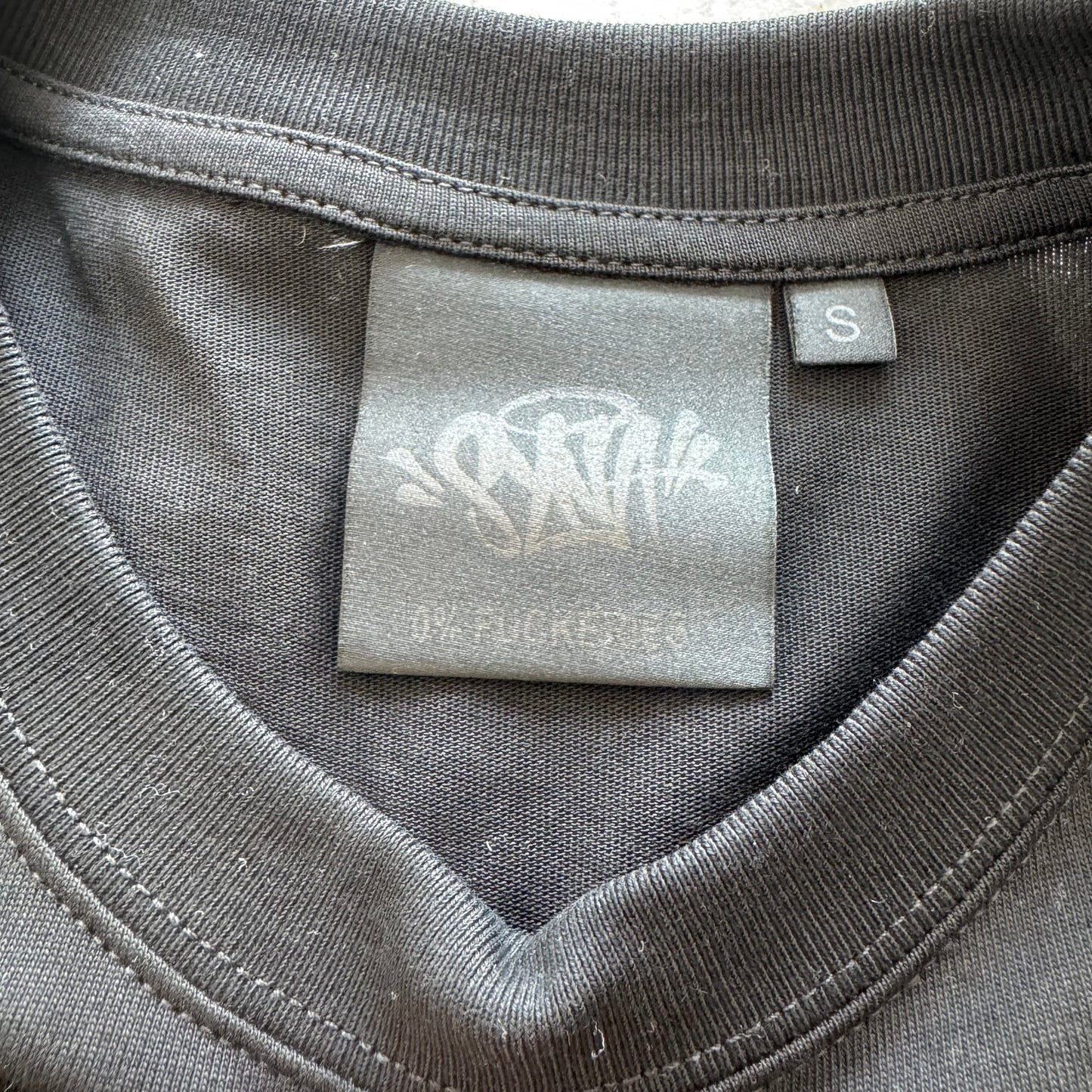 Camiseta Syna World
