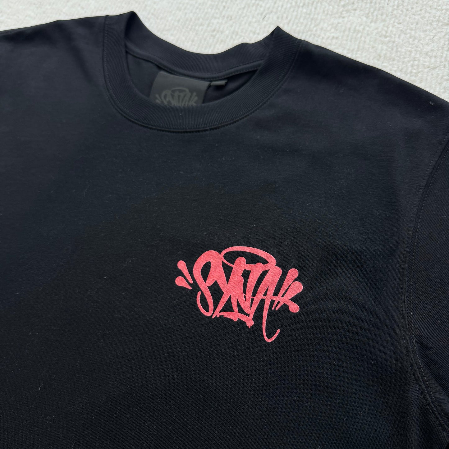 Camiseta Syna World