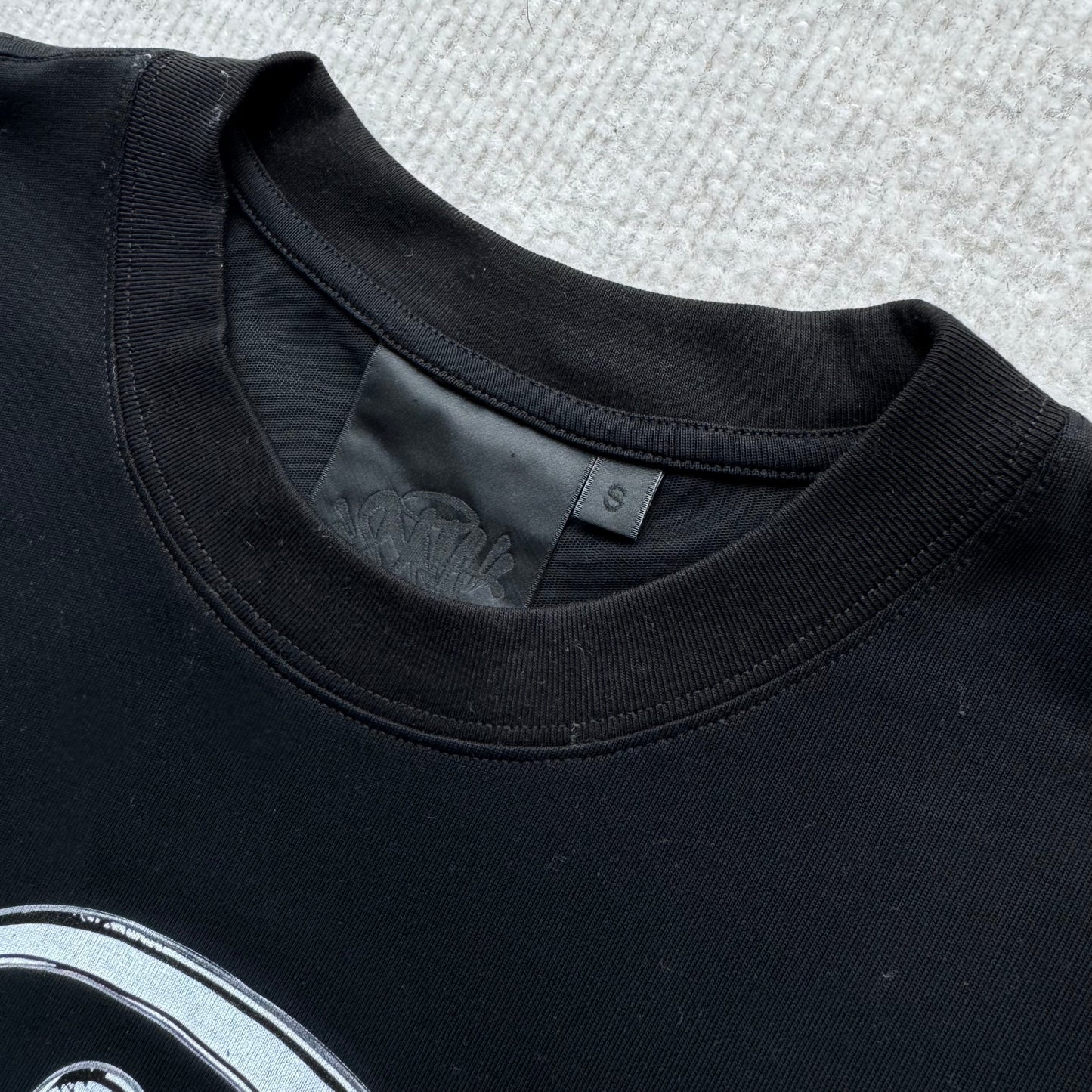 Camiseta Syna World