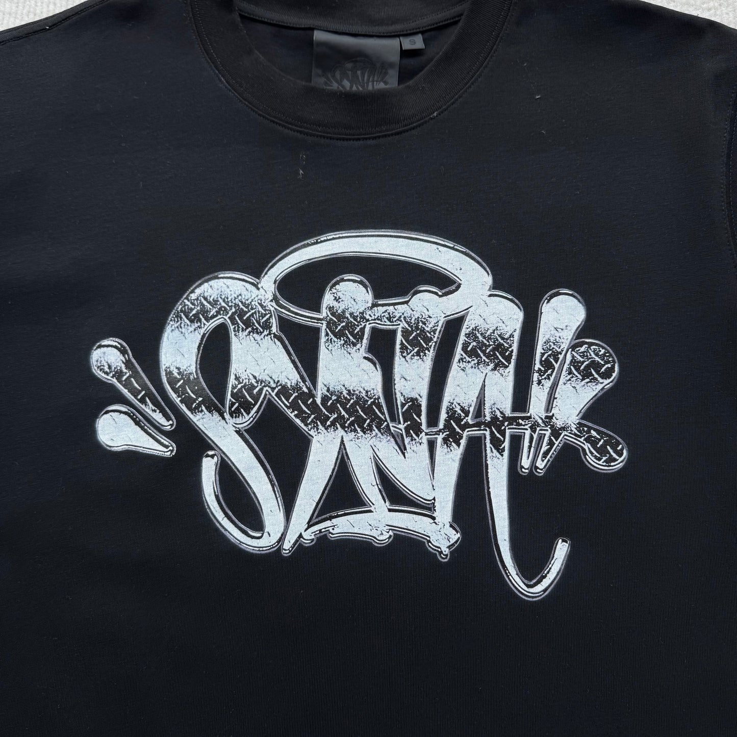 Camiseta Syna World