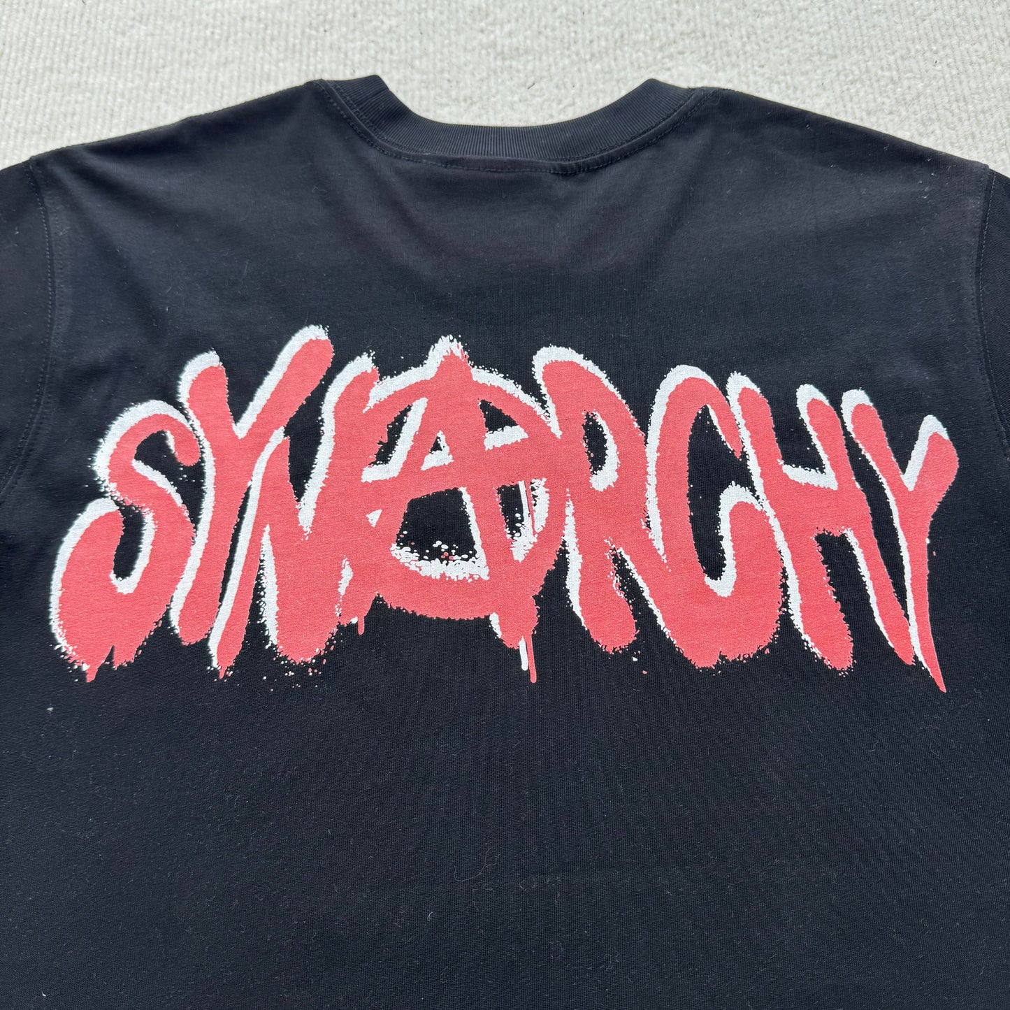 Camiseta Syna World